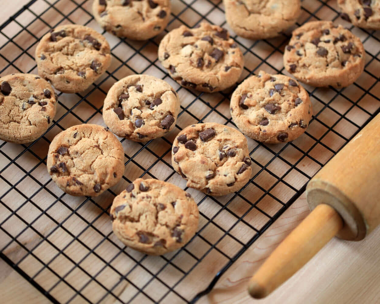 Freshly baked gluten free cookies cooling on a rack, showcasing the benefits of gluten free cookies.